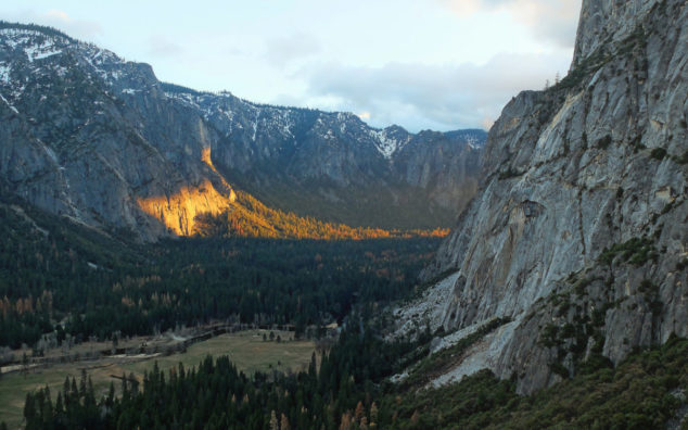 View of the last sun rays, shining on the side of the cliff.